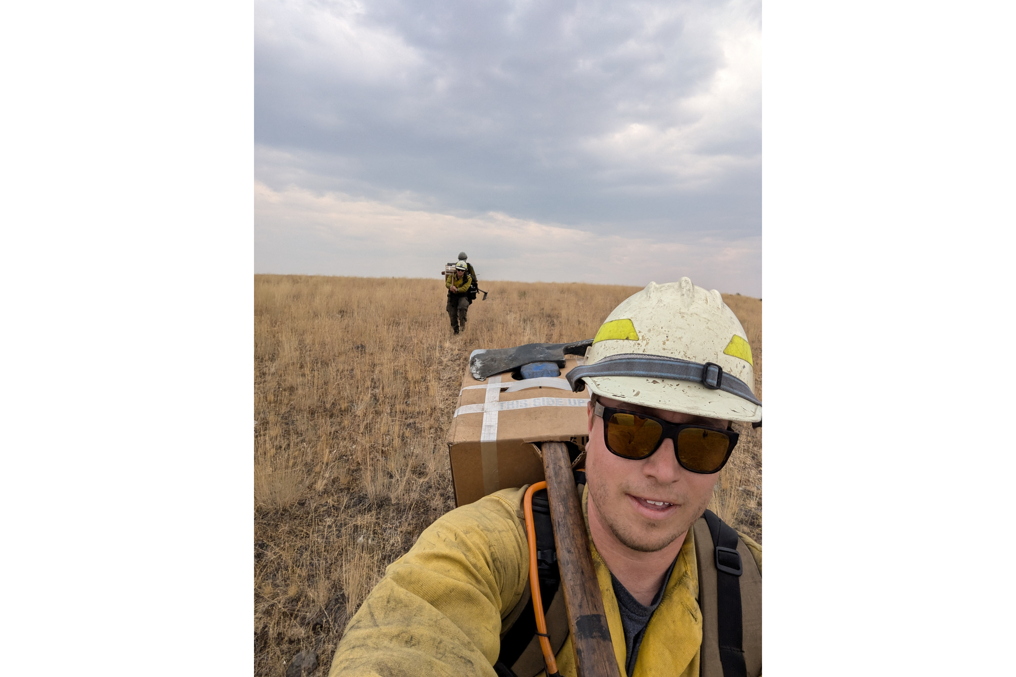 Wildland firefighter takes a selfie in his gear. 