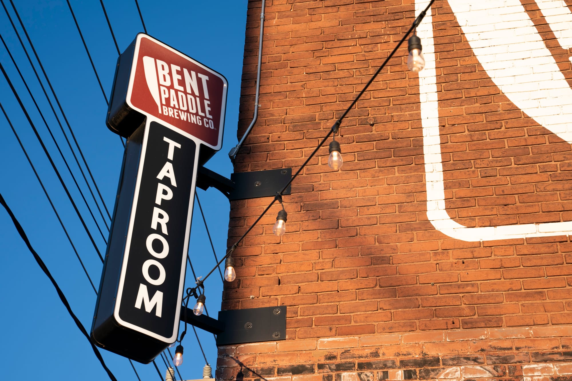 An exterior photo of a brewing company's taproom. 