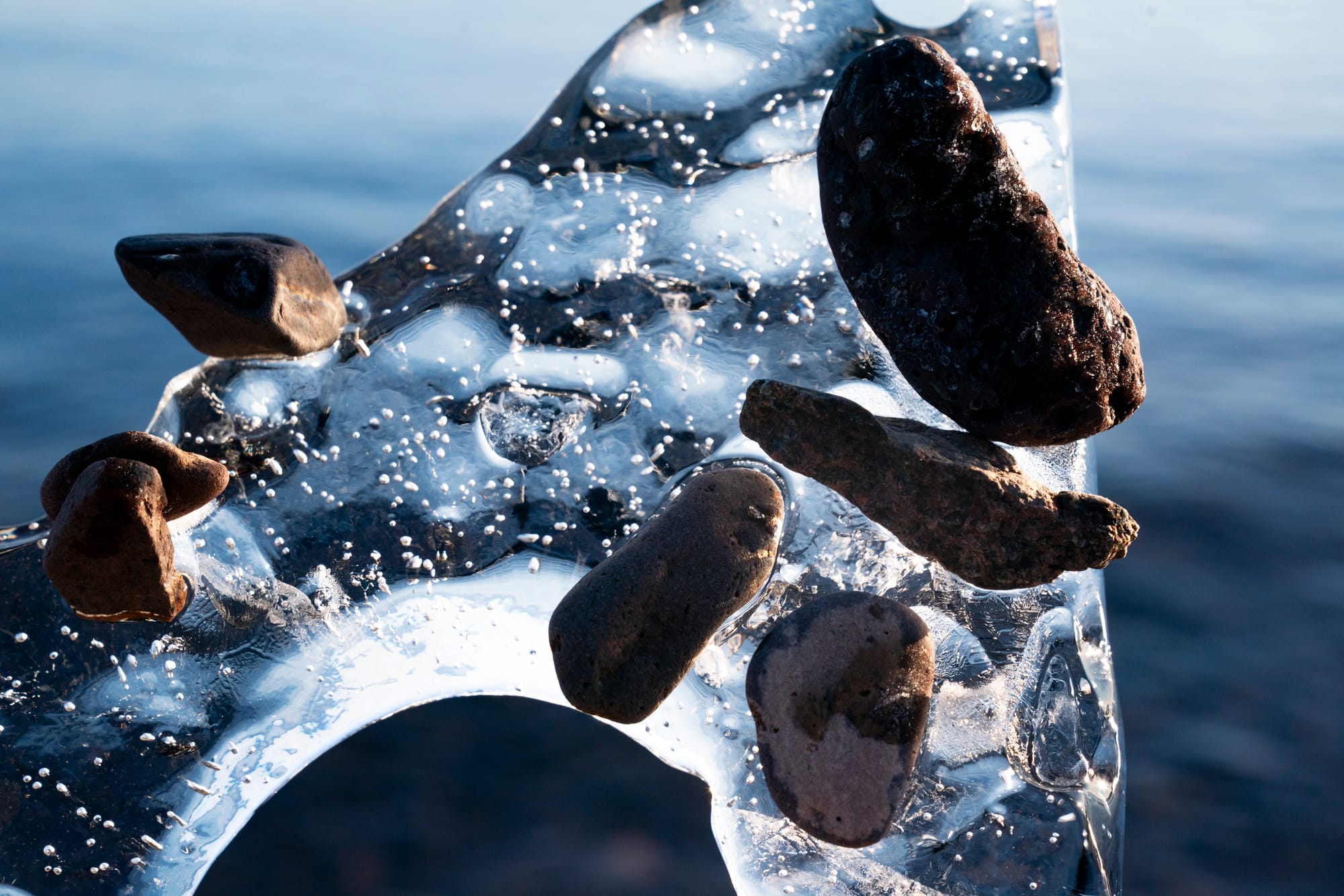 Stones stick to ice formed by Lake Superior in Duluth, Minn. 