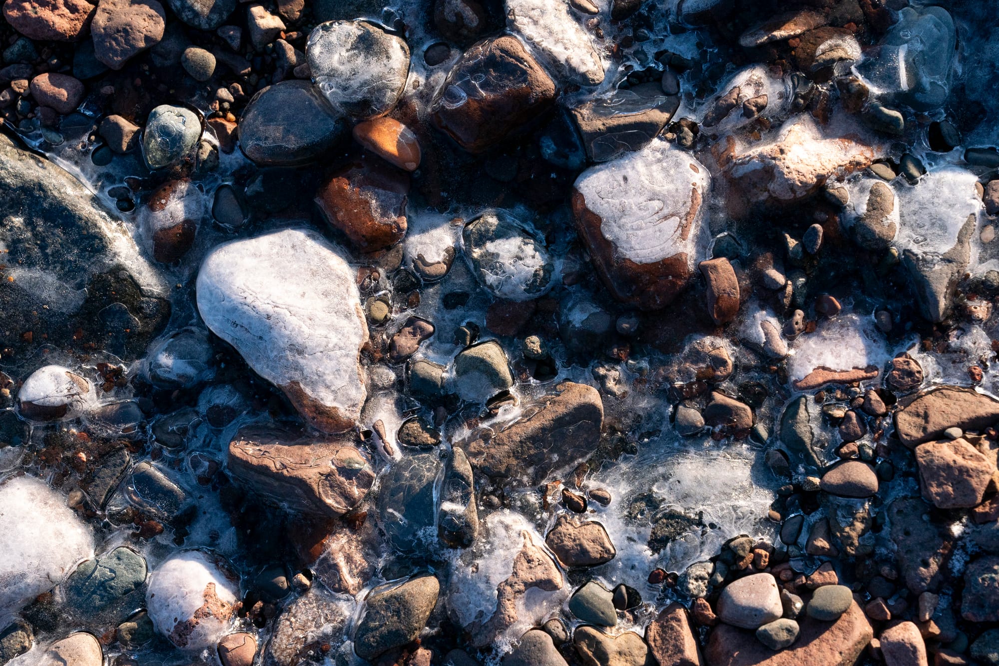 Ice forms along a rocky part of the Lake Superior shoreline in Duluth, Minn.