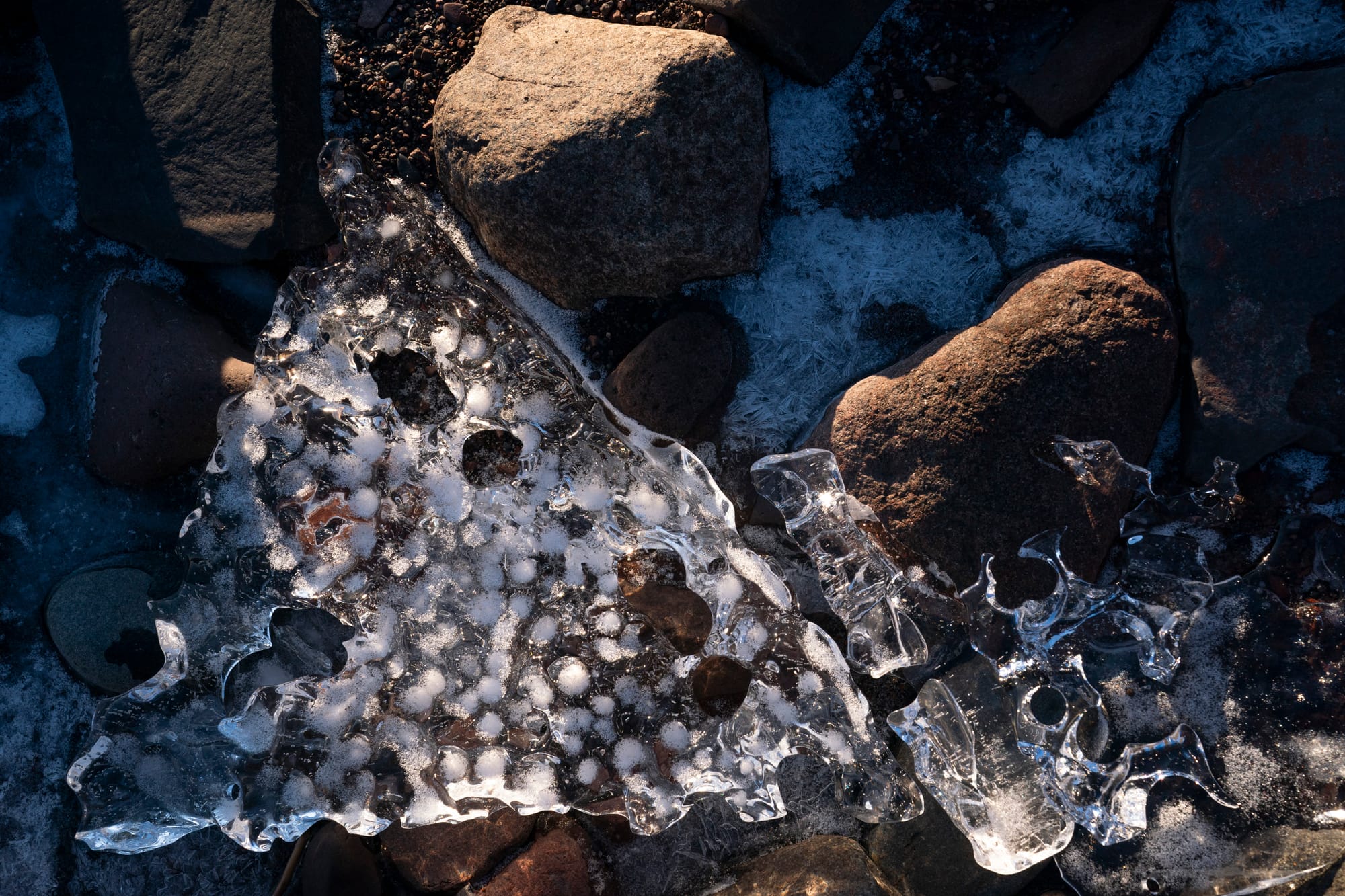 Ice forms along rocks on the Lake Superior shoreline in Duluth, Minn. 