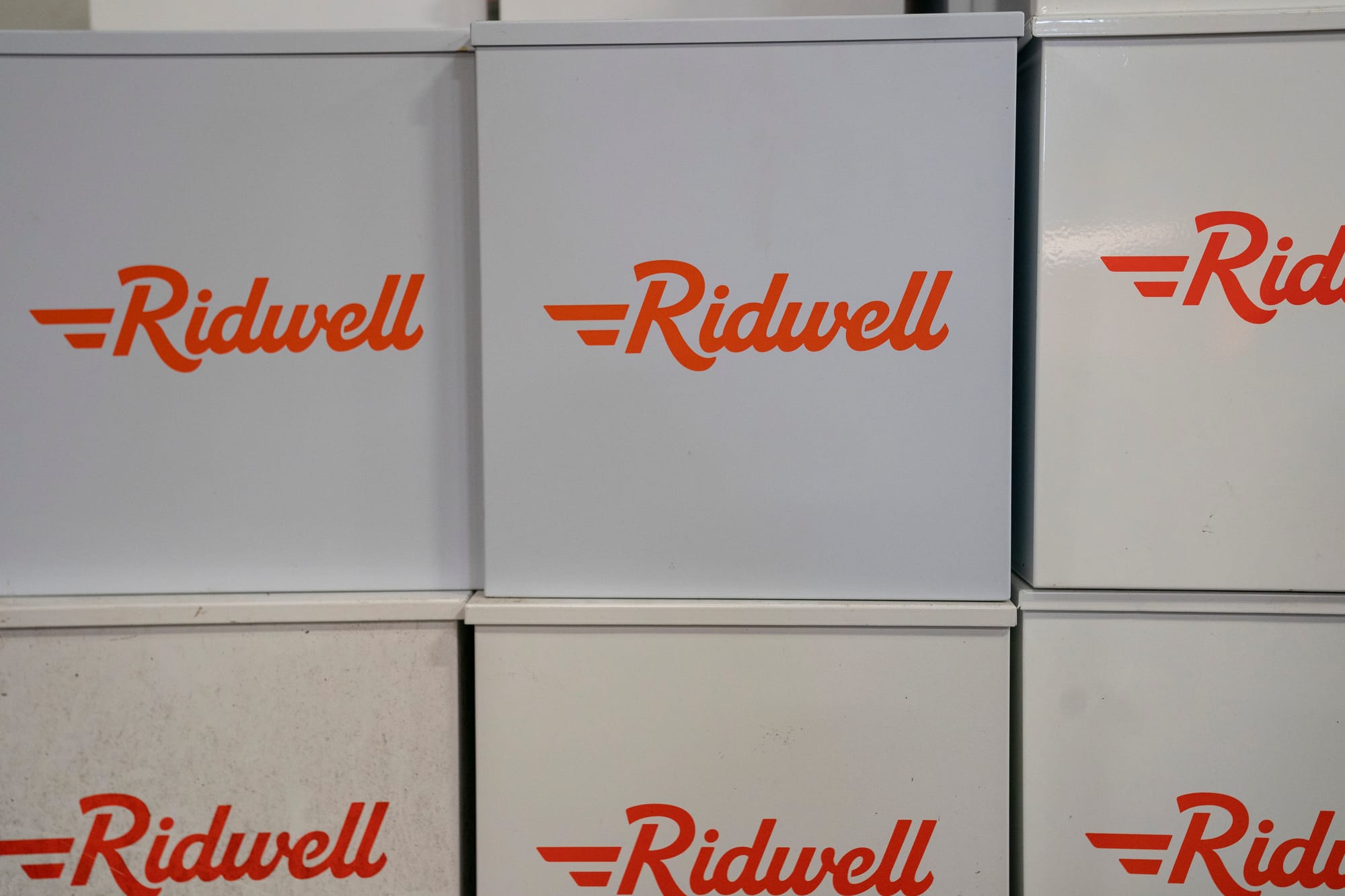 Ridwell-branded boxes are stacked up. 