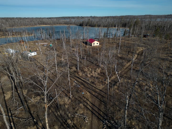 Cabins are seen among burned areas of forest near Isabella, Minn. 