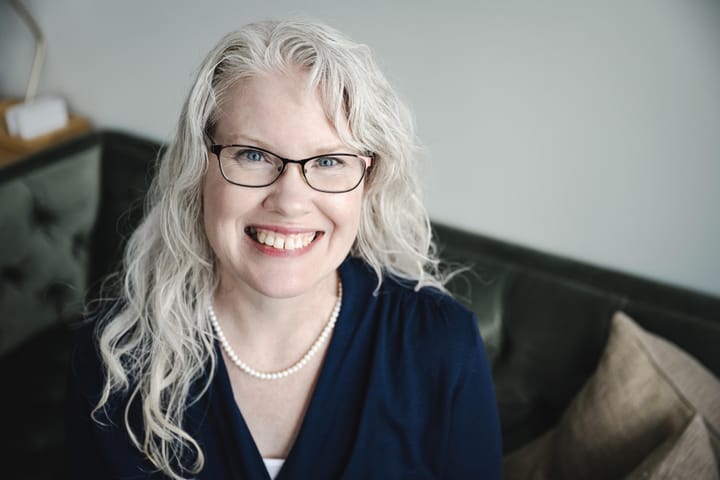 Woman poses for a portrait. 